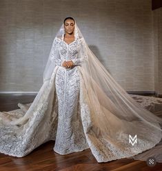 a woman wearing a wedding gown and veil