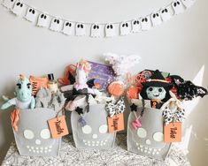 three halloween treat bags sitting on top of a table