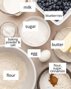 ingredients to make blueberry muffins laid out on a table