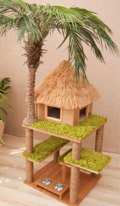 a small tree house with grass on the floor