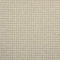 an upholstered fabric textured with small squares