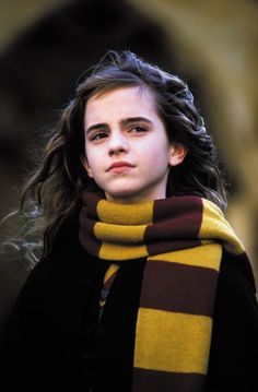 a girl with long hair wearing a scarf