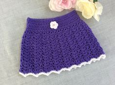 Pretty crochet baby winter skirt in gorgeous lavender colour and features  front and features white flower on the front Made from 100% acrylic 8 ply yarn. Size approx: newborn to 3 months Measurements:  Waist:  42cm Waist to hem: 22cm All items listed in my store are a finished product and are ready to be shipped immediately.   MADE IN A SMOKE FREE ENVIRONMENT 😊 Crochet Baby Skirt, Baby Pink Clothes, White Baby Dress, Purple Girls Dress, Gift For Baby Girl, Crochet Baby Girl Dress, Crochet Skirts, Skirt Purple, Handmade Baby Gifts