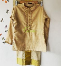 The Outfit consists of Kurtha and Mundu.The Kurtha made of Rawsilk fabric and is embellished with maggam work.The quality and embellishments makes this unique.The Mundu is made of premium quality Kerala Handloom Kasavu fabric.Velcro pasting at waist. So it’s easy to wear for kids.The Kurtha is lined with soft cotton fabric.Size: The picture shows 5-7 year baby boys dress.Any customisation of colours of Kurtha, please let me know. Festive Silk Straight Kurta Set, Festive Tussar Silk Kurta With Embroidered Border, Festive Silk Thread Straight Kurta Set, Festive Straight Kurta Set With Gold Embroidery, Navratri Chanderi Churidar With Gold Embroidery, Festive Gold Embroidery Straight Kurta Set, Embroidered Tussar Silk Churidar With Traditional Drape, Tussar Silk Churidar With Embroidered Border, Diwali Straight Kurta Set With Gold Embroidery