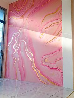 a pink and gold wall in an office building