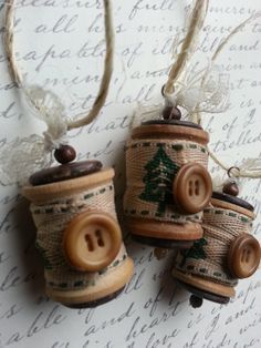 three wooden buttons are attached to some string