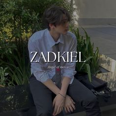 a young man sitting on top of a bench wearing a tie and dress shirt with the words zadkiel