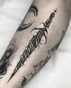 a man's arm with some writing on it