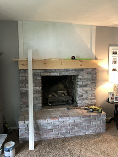 a living room with a fire place in it