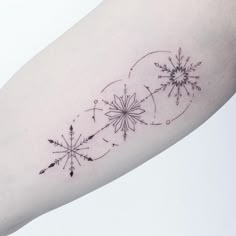 a snowflake tattoo on the left arm