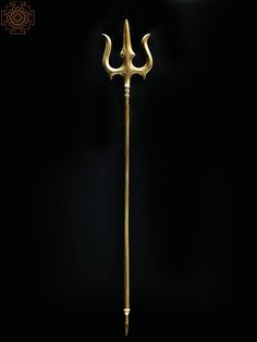 an old fashioned metal pole with two long spears on it's end, in the dark