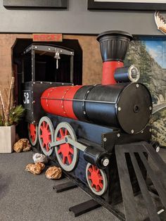 a toy train is on display in a museum