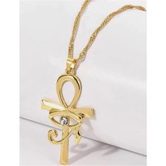 Twosret Ankh and Eye of Horus Necklace - Trufacebygrace Gold Ankh Metal Jewelry, Gold Metal Cross Charm Necklaces, Gold Ankh Shaped Metal Jewelry, Gold Alloy Necklaces As Gift, Elegant Ankh-shaped Metal Jewelry, Gold Alloy Pendant Necklace, Gold Pendant Necklace In Alloy, Gold Metal Cross Jewelry, Gold Cross-shaped Metal Jewelry