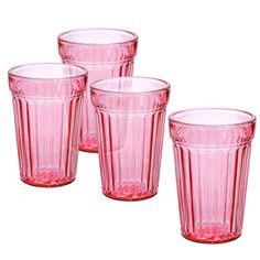 four pink glass cups sitting next to each other