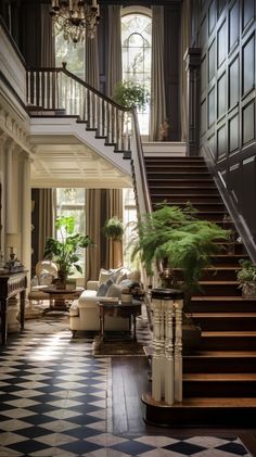 an elegant foyer with black and white checkered flooring, potted plants and chandelier