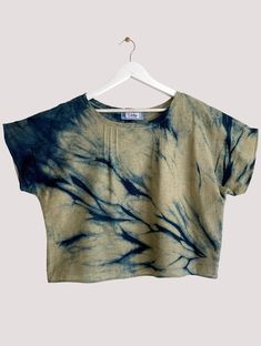 a crop top with blue and yellow dye on it