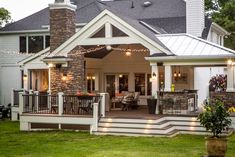 a house with lights on the front porch