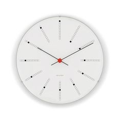 a white clock with red hands and numbers on the face is shown against a white background