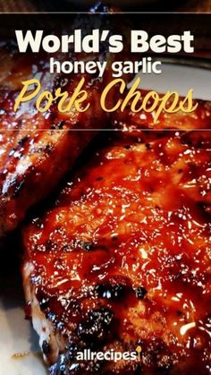 grilled pork chops with bbq sauce on the side and title world's best honey garlic pork chops