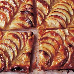 apple tarts cut into squares on a baking sheet