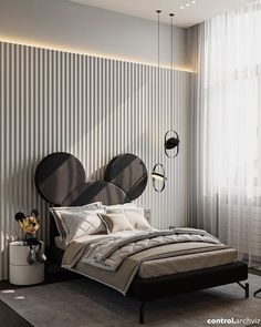 a bed with two round mirrors on the wall above it and a lamp hanging from the ceiling