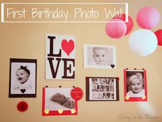 a baby's first birthday photo wall with pictures and lanterns