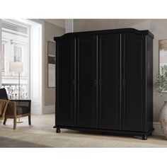 a black armoire in a living room