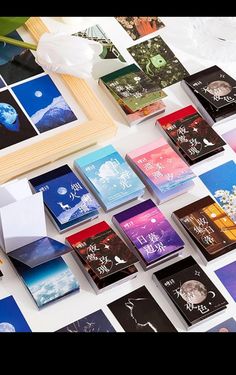 many different colored cards on a white table