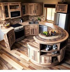 a kitchen with wooden floors and an island in the middle, surrounded by cabinets that are made out of wood