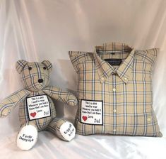 two teddy bears sitting next to each other on a white sheeted surface, one is wearing a shirt and the other has a button down collar