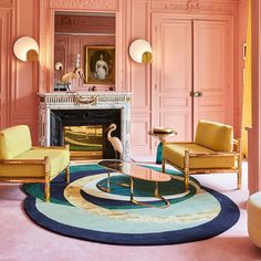 a living room with pink walls and furniture