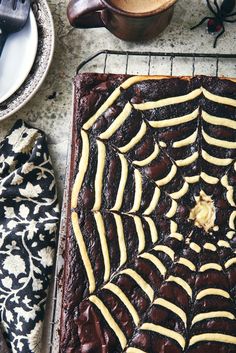 a spider web cake sitting on top of a pan