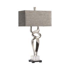 a table lamp with a grey shade on it and a white square light in the middle