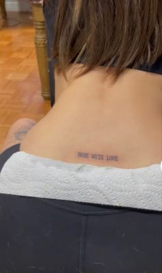 a woman with a tattoo on her back