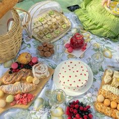 a table topped with lots of different types of foods and desserts on top of it