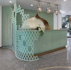 an ornately designed reception counter in a hotel lobby