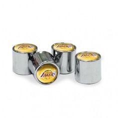 four silver metal canisters with lakers logo on the top and one yellow in the middle