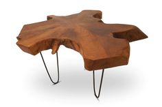 a wooden table with hairpin legs and a large piece of wood in the middle