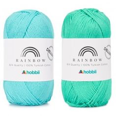 two skeins of yarn in aqua blue and green colors, each with a rainbow logo