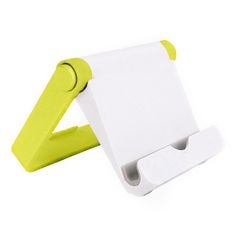 a yellow and white paper holder on a white background with clippings attached to it