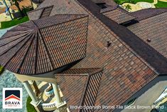 an aerial view of a house with a brown roof