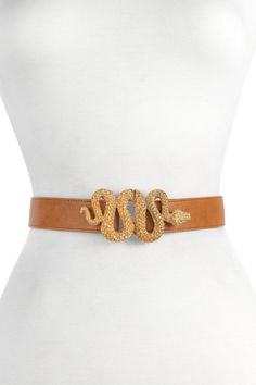 A glam take on the snake buckle trend. A gold-tone and textured snake takes center stage here and serves as the front clasp. Gold-tone slithering snake buckle. Fully adjustable. Leather construction. Approx. 1" width. Made in USA Chic Gold Belt With Buckle Closure, Chic Gold Belt, Gold Belt With Buckle Closure For Formal Occasions, Elegant Gold Belt With Buckle Closure, Slithering Snake, Venom Snake, Designer Belts, Fashion Belts, The Snake