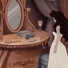 an animated image of a woman looking at herself in front of a dressing table and mirror