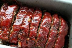 the meatloaf is covered in sauce and ready to be cooked on the grill