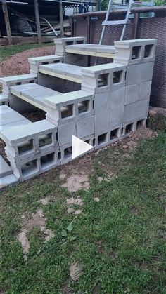 several concrete steps are placed in the grass