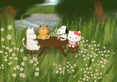 three cats are sitting at a table in the grass