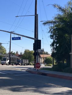 a stop sign on the corner of an intersection