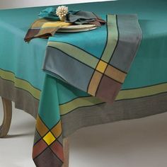 a table with a green and brown plaid design on it