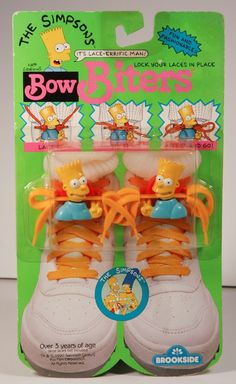 the simpsons shoes are yellow and white with orange laces on each shoe, as well as