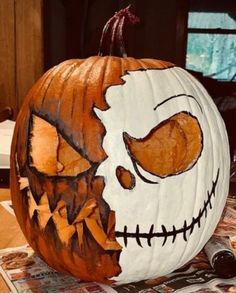 a pumpkin with a face painted on it